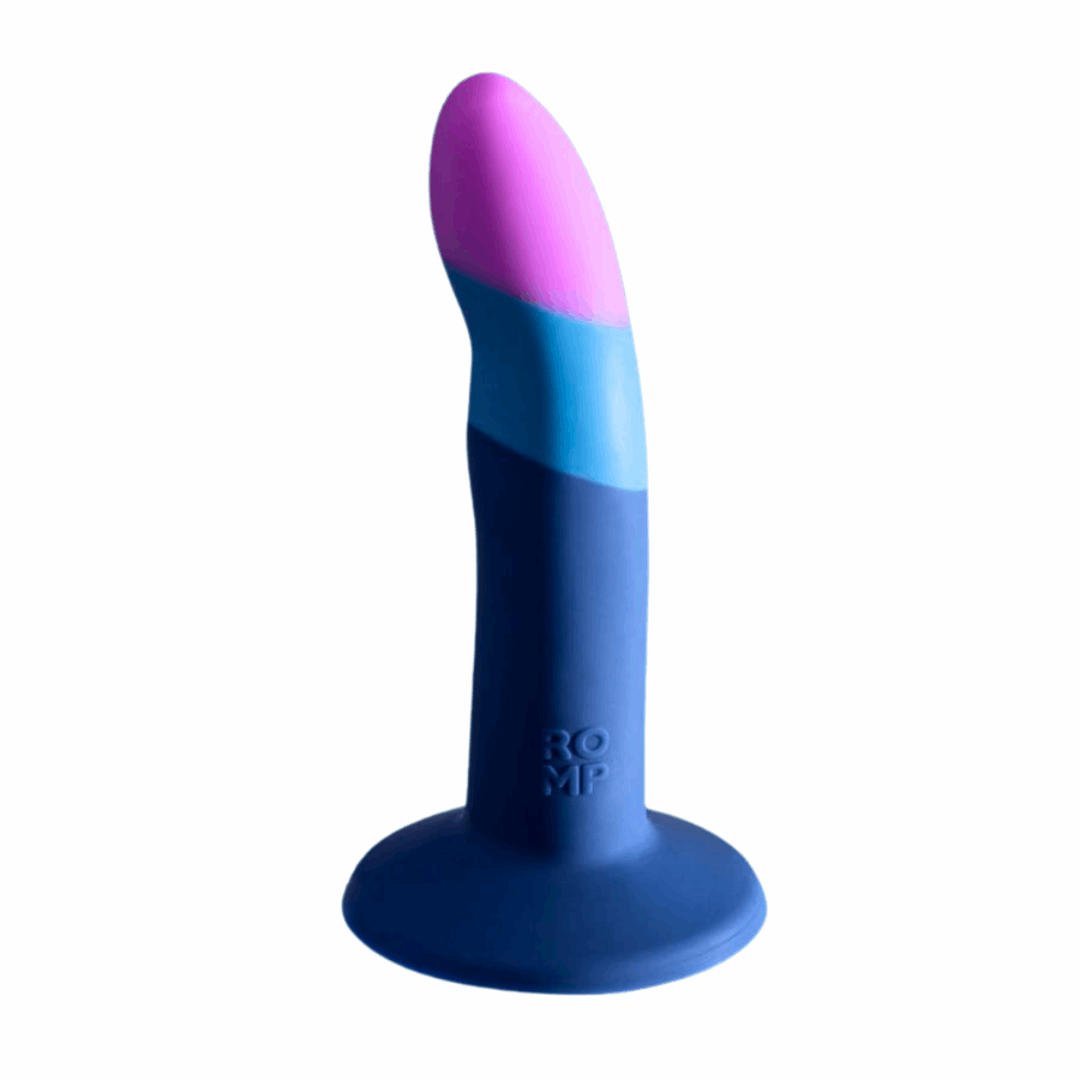 5-inch curved silicone dildo with suction-cup base, harness compatibility, and bullet vibe pairing.
5-inch silicone dildo, curved dildo, g-spot and p-spot stimulation, suction-cup dildo, strap-on compatible dildo, double penetration dildo, ROMP Riot compatible, waterproof silicone dildo, beginner-friendly dildo, body-safe non-realistic dildo, blue silicone dildo, purple silicone dildo.