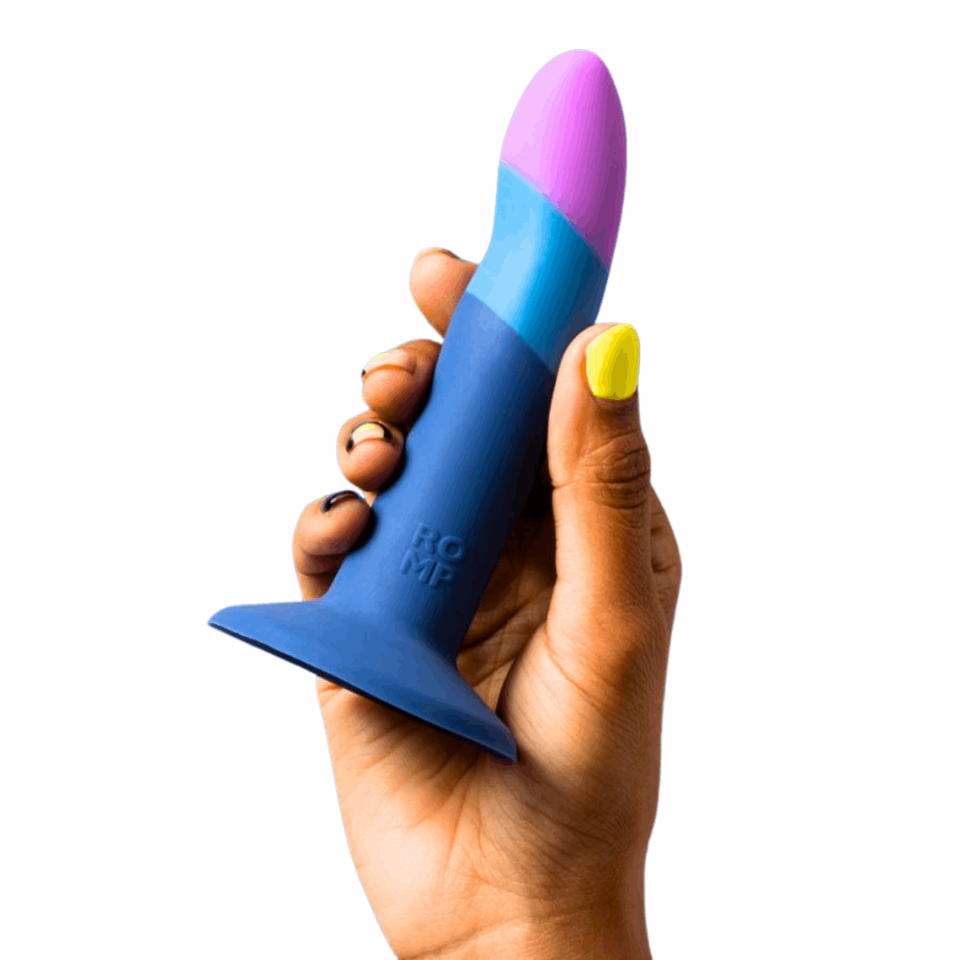 5-inch curved silicone dildo with suction-cup base, harness compatibility, and bullet vibe pairing.
5-inch silicone dildo, curved dildo, g-spot and p-spot stimulation, suction-cup dildo, strap-on compatible dildo, double penetration dildo, ROMP Riot compatible, waterproof silicone dildo, beginner-friendly dildo, body-safe non-realistic dildo, blue silicone dildo, purple silicone dildo.