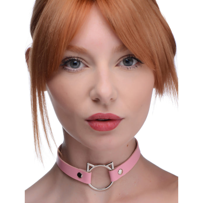 Kitty play choker in pink or black, with cat-shaped O-ring, adjustable snap buttons, and lightweight PU leather design for stylish, comfortable wear.