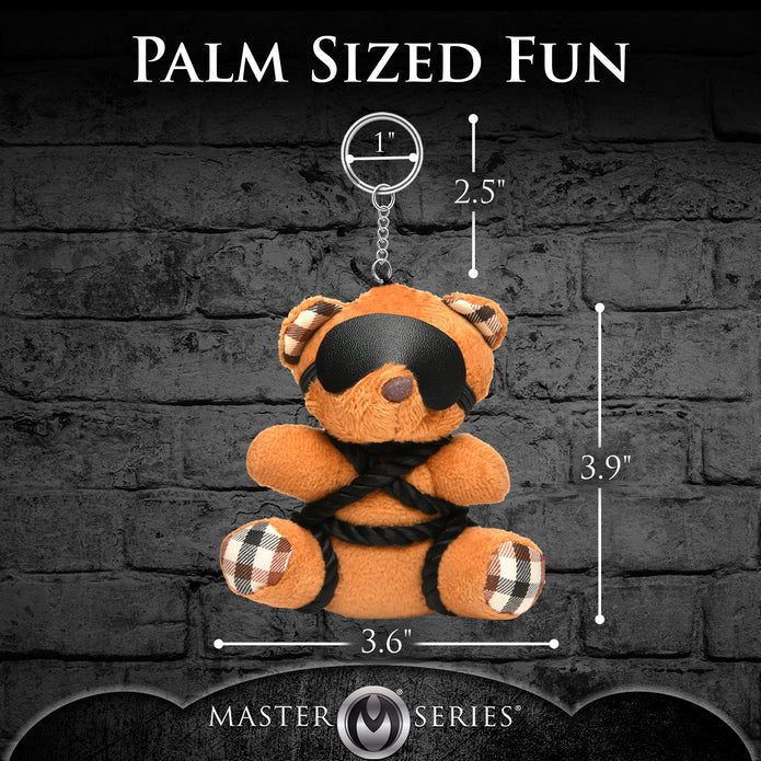 Burnt orange teddy bear keychain tied in silky rope bondage with a removable blindfold, a fun novelty accessory or gift.
shibari teddy bear keychain, rope bondage bear keychain, BDSM novelty gift, bondage bear keychain accessory, kinky teddy bear gift, burnt orange bear keychain, shibari rope bear, playful bondage bear keychain, BDSM-themed keychain gift, novelty shibari bear accessory
