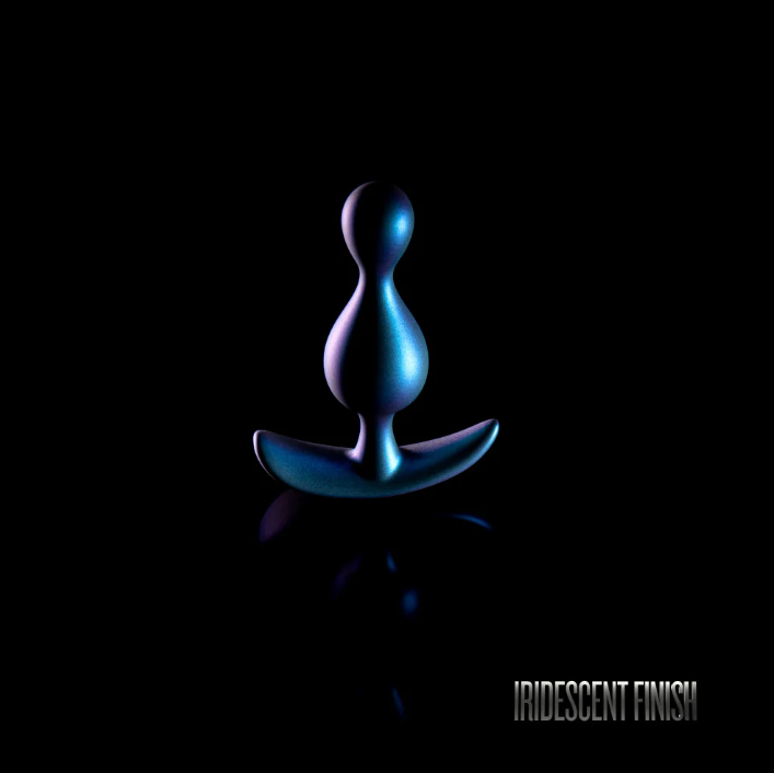 Matrix Photon Plug. Its dual pleasure bumps, StayPut™ design, and soft Puria™ silicone deliver comfort and security. Perfect for long-term wear, it shines with a unique iridescent finish for added allure. 4.5" x 1.25" size.