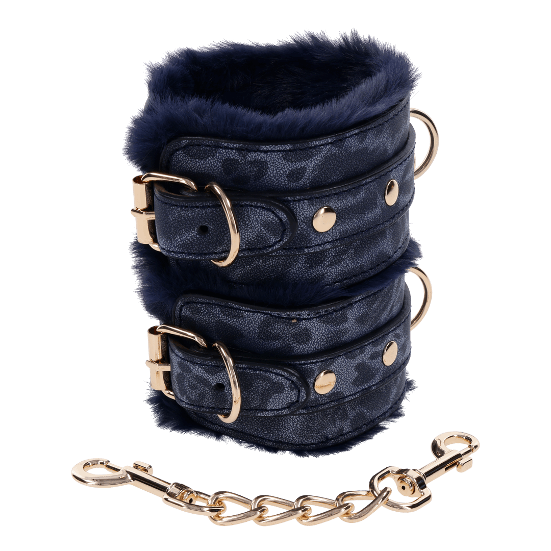 Cougar Fur Handcuffs with soft blue faux fur lining, gold-plated hardware, and adjustable buckle cuffs for elegant bondage play.