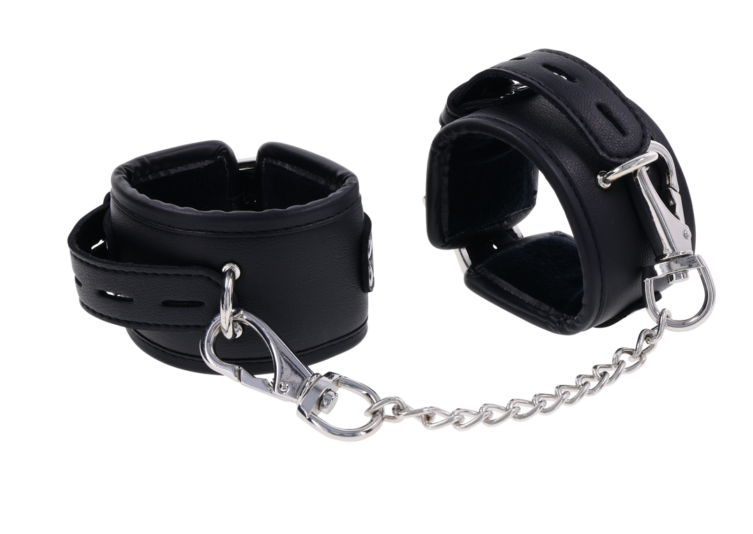 Edge® Handcuffs with padded black design, adjustable buckle closure, and removable metal tether for comfortable and secure BDSM play.