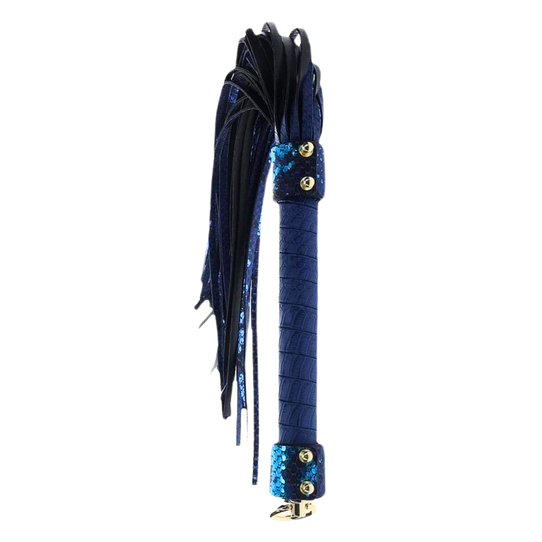 Elegant flogger with a textured handle, gold-tone accents, and durable falls, available in blue, white, and black, perfect for stylish BDSM play.