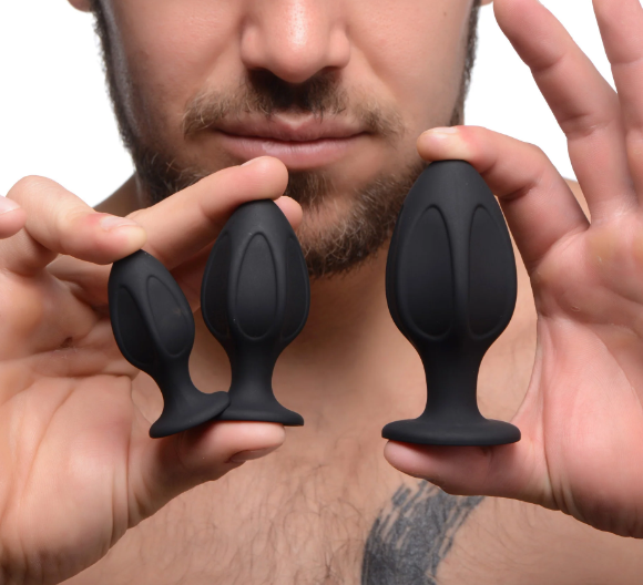 Master Series Triple Juicers: Three star-shaped silicone plugs with suction bases, perfect for anal training. Graduated sizes ensure pleasure for every skill level.
