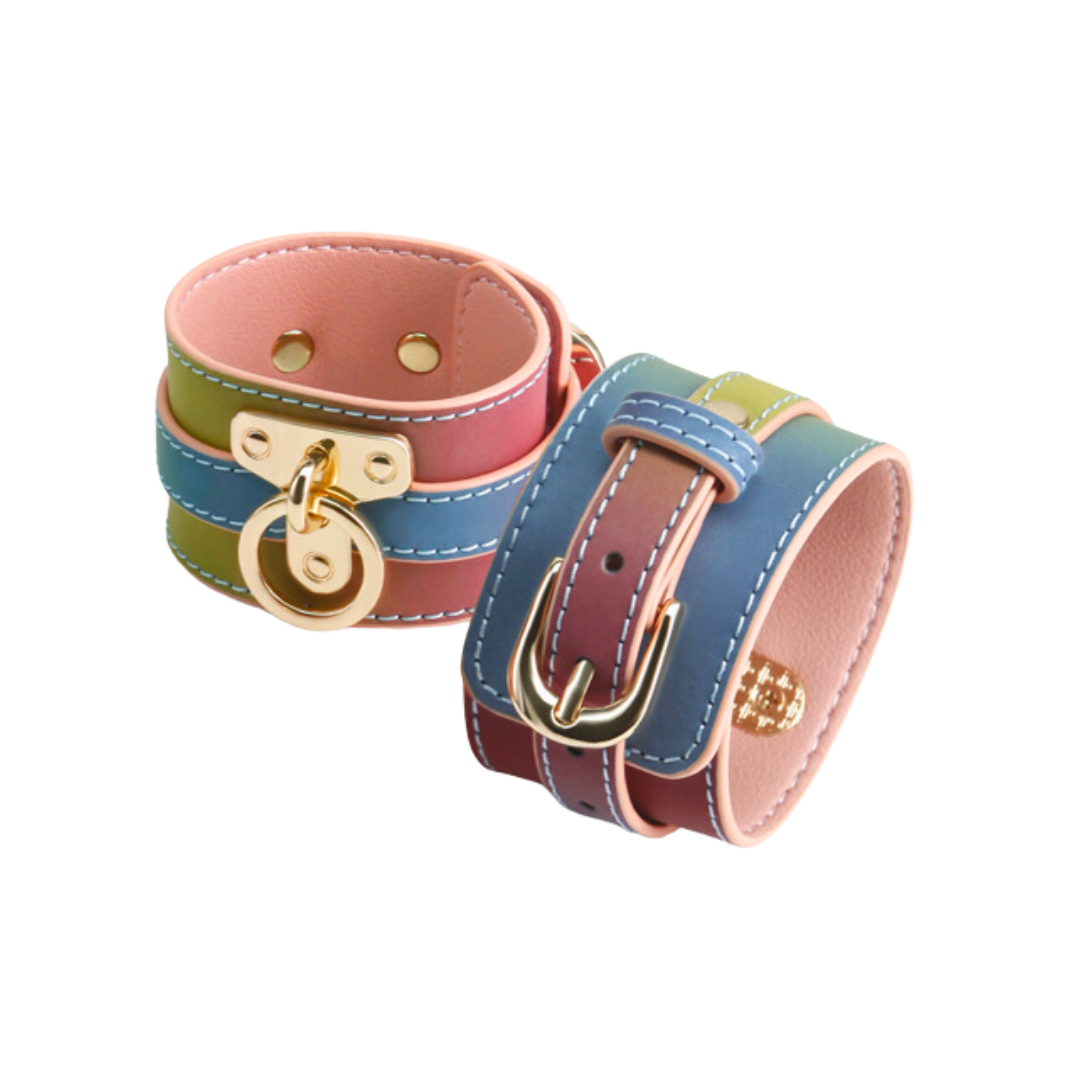 Rainbow bondage wrist cuffs with adjustable faux leather straps and couture hardware for BDSM play.
Keywords: Spectra Bondage Wrist Cuffs Rainbow, rainbow BDSM wrist cuffs, colorful bondage restraints, faux leather handcuffs, NS Novelties wrist cuffs, adjustable BDSM restraints, stylish bondage gear, vibrant fetish cuffs, kink wrist cuffs, rainbow bondage accessories.
