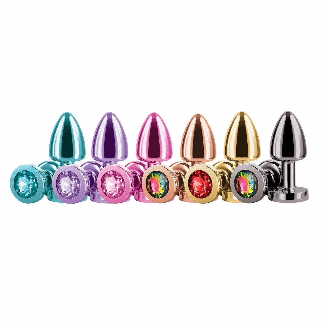 A collection of Rear Assets chrome-plated anal plugs in a variety of colors, each featuring a jeweled base for added visual appeal.