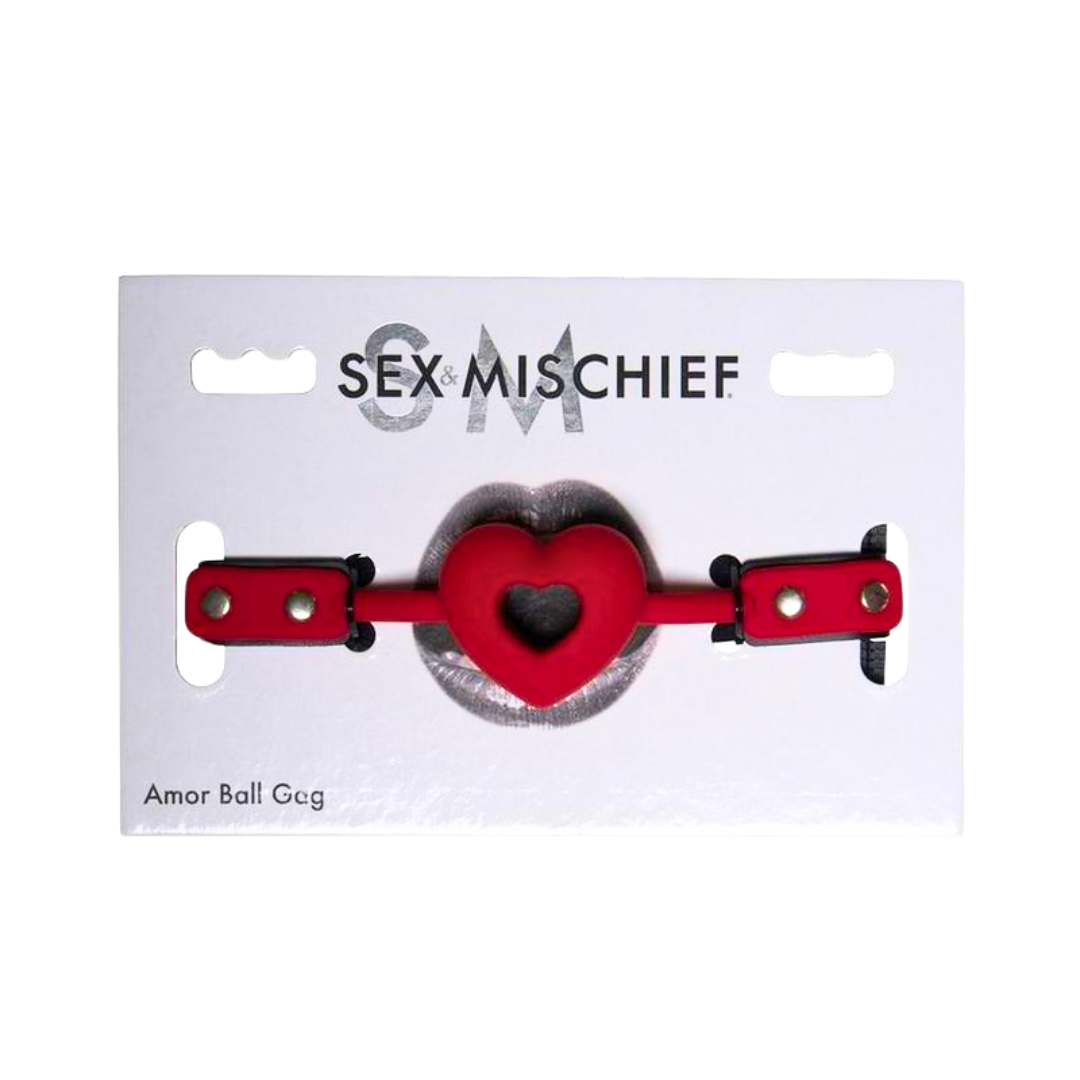 Sex and Mischief Amor Ball Gag with a heart-shaped breathable design, adjustable buckle strap, and durable PU leather and silicone materials.
Amor Ball Gag, heart-shaped ball gag, breathable ball gag, beginner BDSM gag, adjustable BDSM gag, PU leather gag, romantic ball gag, BDSM accessories, silicone ball gag, playful bondage gear.