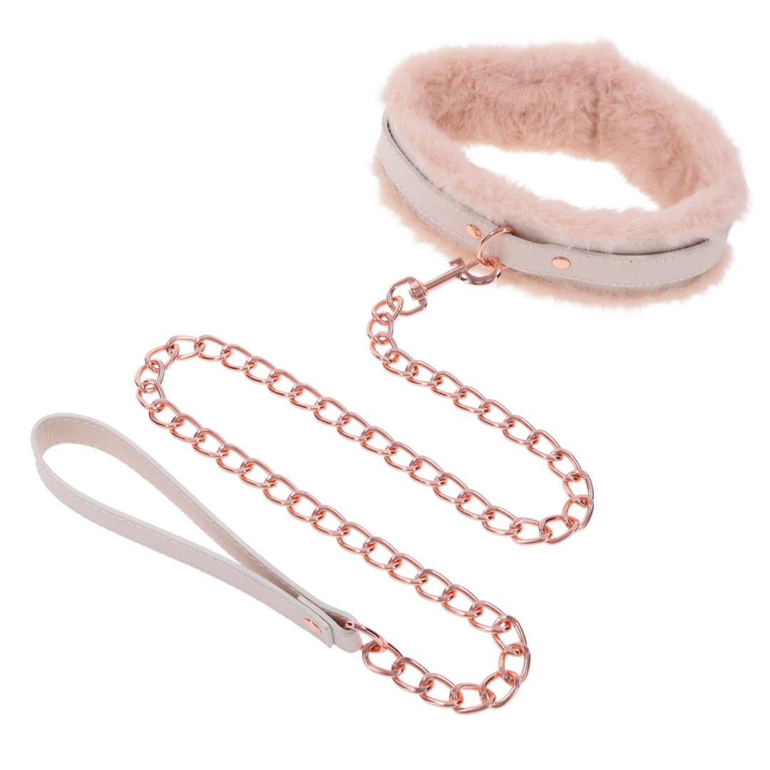 Luxurious peach-colored faux fur collar and leash set with rose gold hardware. Adjustable fit, detachable leash, and perfect for intimate power play or flirty fun.