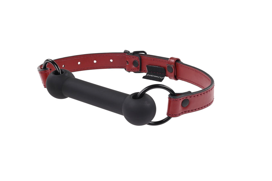 Saffron Silicone Bit Gag with adjustable vegan leather strap, designed for comfort and secure BDSM play. Keywords: Saffron silicone bit gag, vegan leather bit gag, BDSM gag, bondage gag, silicone gag for BDSM, adjustable bit gag, Sportsheets gag, BDSM accessories, vegan leather bondage gear, comfortable BDSM gag, kink gag for couples.