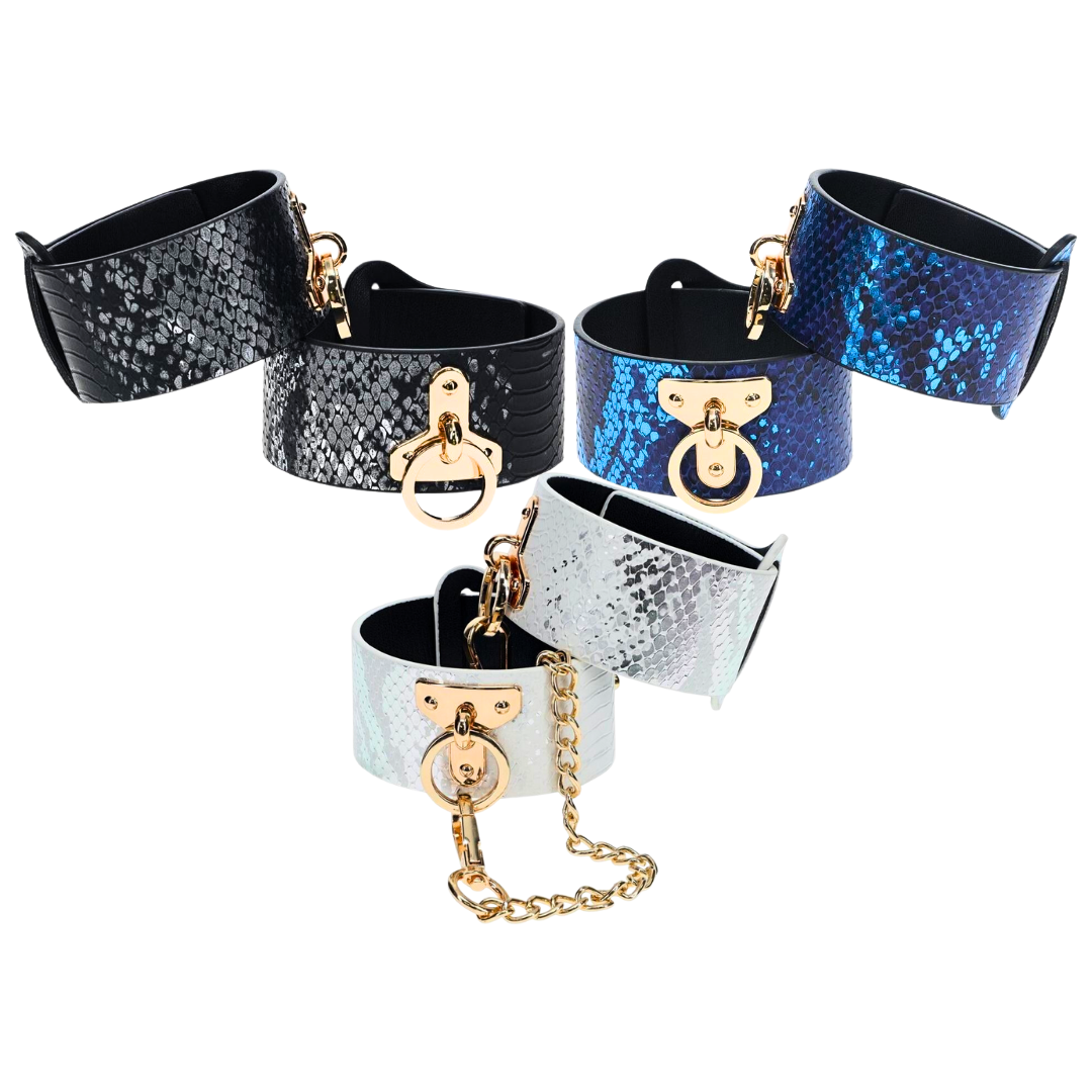 The Florence Iridescent Snake BDSM Ankle Cuffs by Ouch! feature bonded leather, gold-tone hardware, and adjustable straps for stylish and functional restraint.