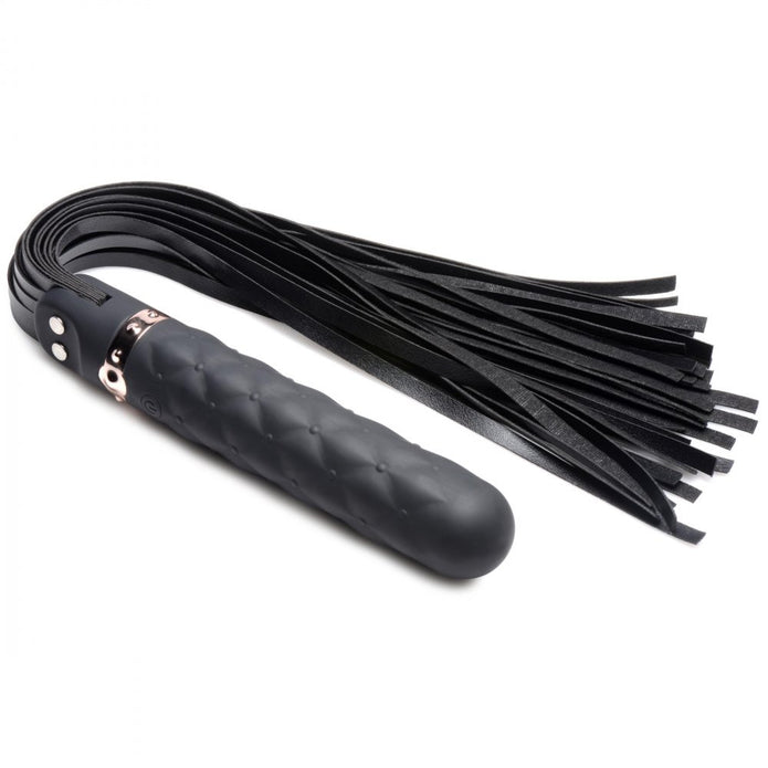 A Vibra-Lasher flogger featuring a black silicone dildo handle with a rose gold accent and durable faux leather falls, designed for vibration and impact play.