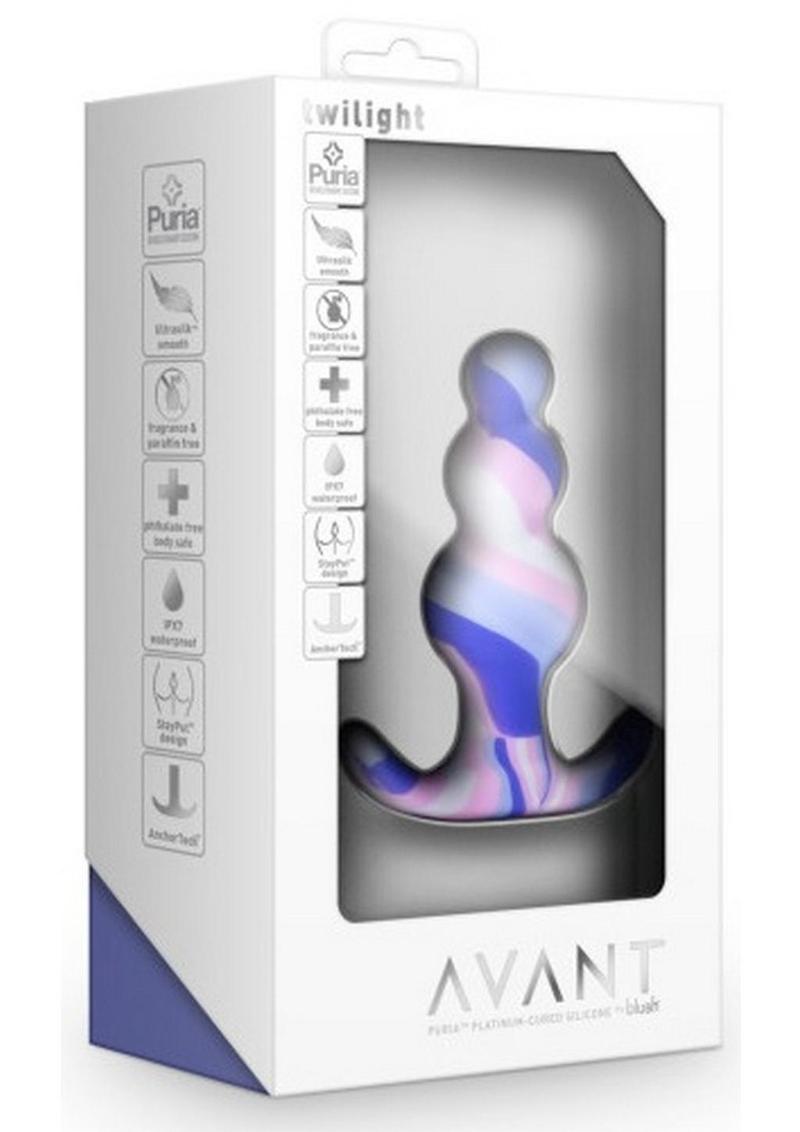 Packaging of the Avant Twilight Butt Plug, showcasing its bright multicolored design and key features, including Ultrasilk® smooth finish, AnchorTech™ base, and body-safe Puria™ silicone.