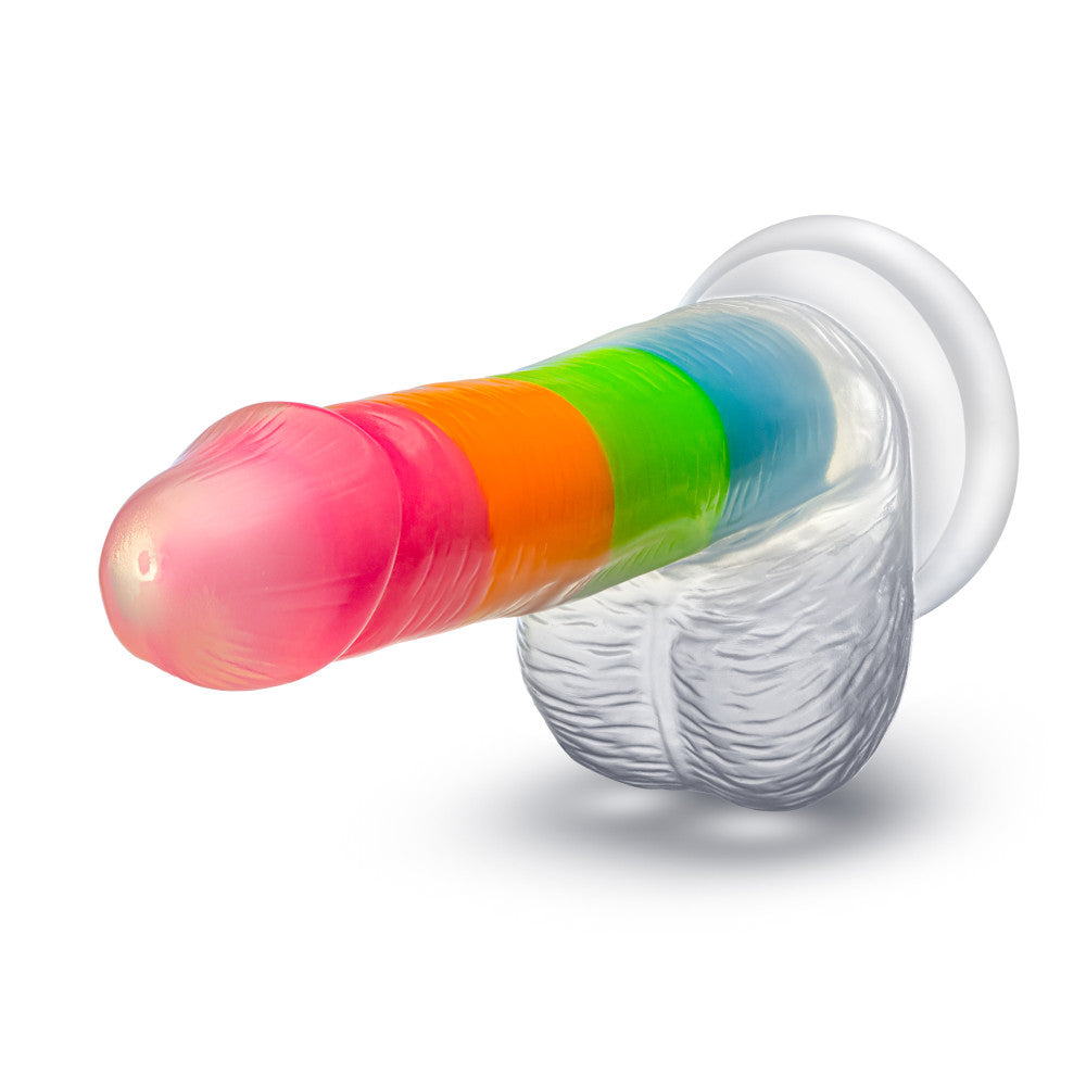 A vibrant glow-in-the-dark rainbow dildo with dual-density silicone, a suction cup base, and lifelike details. Perfect for hands-free or strap-on play. Keywords: Neo Elite Rainbow Rave, glow-in-the-dark dildo, rainbow dildo, Sensa Feel, dual-density silicone, Purio silicone, harness-compatible dildo, suction cup dildo, body-safe silicone, lifelike dildo, beginner-friendly toy