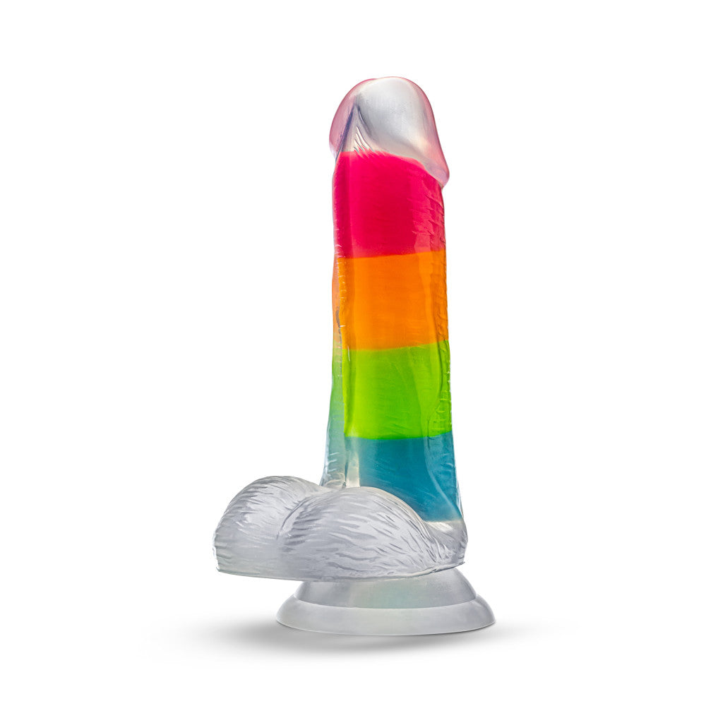 A vibrant glow-in-the-dark rainbow dildo with dual-density silicone, a suction cup base, and lifelike details. Perfect for hands-free or strap-on play. Keywords: Neo Elite Rainbow Rave, glow-in-the-dark dildo, rainbow dildo, Sensa Feel, dual-density silicone, Purio silicone, harness-compatible dildo, suction cup dildo, body-safe silicone, lifelike dildo, beginner-friendly toy