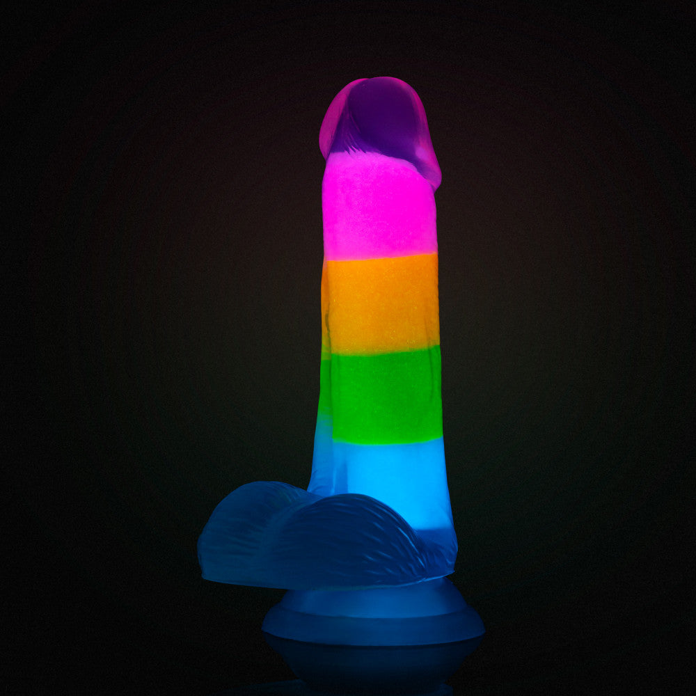 A vibrant glow-in-the-dark rainbow dildo with dual-density silicone, a suction cup base, and lifelike details. Perfect for hands-free or strap-on play. Keywords: Neo Elite Rainbow Rave, glow-in-the-dark dildo, rainbow dildo, Sensa Feel, dual-density silicone, Purio silicone, harness-compatible dildo, suction cup dildo, body-safe silicone, lifelike dildo, beginner-friendly toy