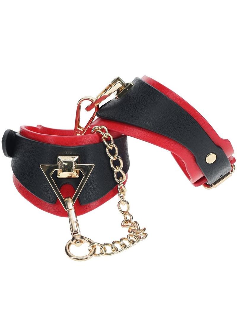 Black and red bonded leather handcuffs with gold chain and decorative accents, designed for stylish and secure BDSM use.
