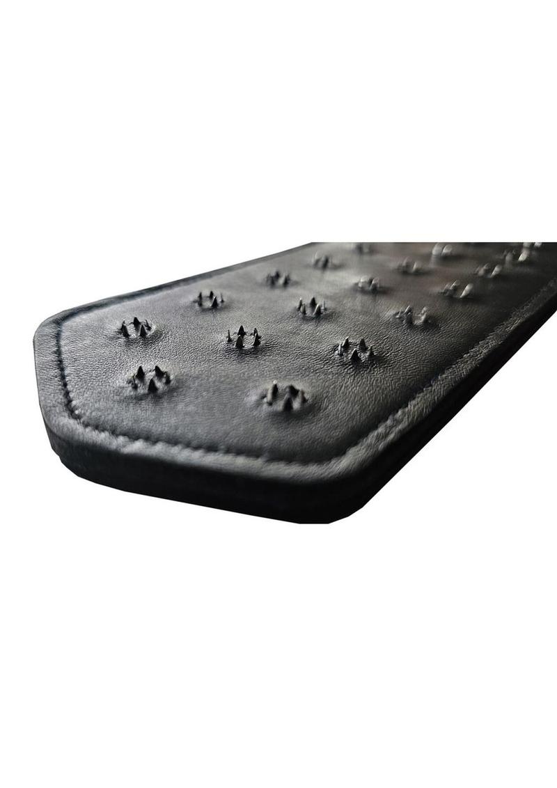 Black leather paddle with 22 metal spike clusters, designed for advanced BDSM impact play.