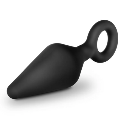 A product image of the Anal Adventures Platinum Silicone Loop Plug Kit by Blush Novelties. The packaging displays three black tapered plugs with loop bases in small, medium, and large sizes, made from 100% silicone with a smooth finish.