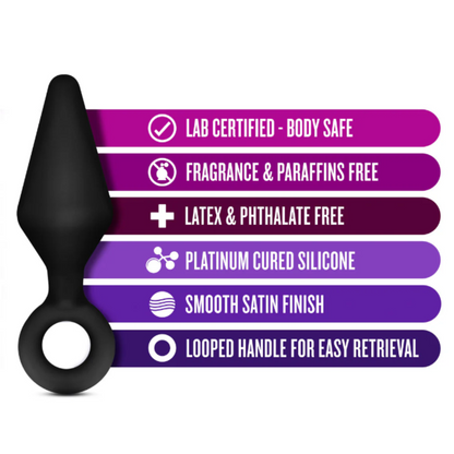 A single black silicone plug from the Anal Adventures Platinum Silicone Loop Plug Kit displayed alongside product features, including lab-certified body-safe material, fragrance and paraffin-free, latex and phthalate-free, platinum-cured silicone, smooth satin finish, and a looped handle for easy retrieval.