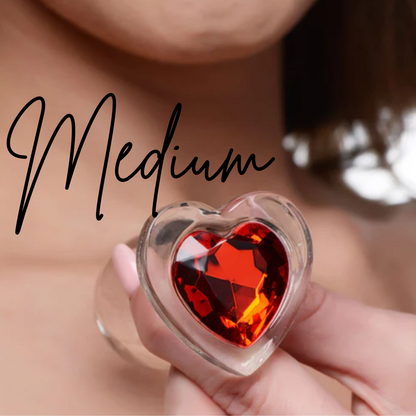 Clear glass anal plug with a red heart-shaped base, available in Small, Medium, or Large, designed for temperature play and smooth, comfortable insertion.

Booty Sparks red heart plug, glass anal plug, heart-shaped anal plug, temperature play anal plug, small glass anal plug, medium glass anal plug, large glass anal plug, red heart butt plug, hypoallergenic anal toy, romantic anal toy