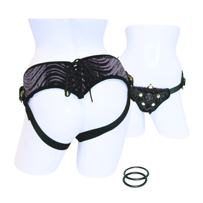 Sportsheets Vibrating Raven Corsette Strap-On Harness with a corset-style back, plush swirl material, interchangeable O-rings, and a vibrating bullet for clitoral stimulation.

