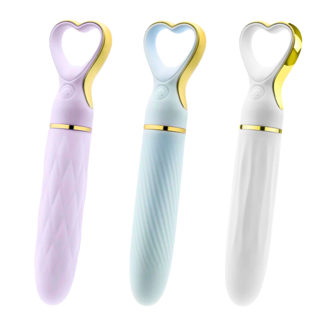 A chic, heart-shaped vibrator with 10 vibration modes, a tapered tip, and a gold-accented handle. Made from soft silicone, it’s splashproof, USB rechargeable, and compact for travel. 
Keywords: Delice vibrator, heart-shaped handle, chic vibrator, Puria silicone, UltraSilk finish, splashproof vibrator, USB rechargeable, travel-friendly vibrator, 10 vibration modes, compact vibrator, body-safe silicone, giftable vibrator