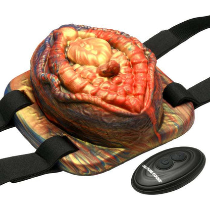 Hell's Angel Vibrating Silicone Grinder with textured vulva design, adjustable neoprene straps, remote-controlled vibrations, and a fiery fantasy aesthetic.

