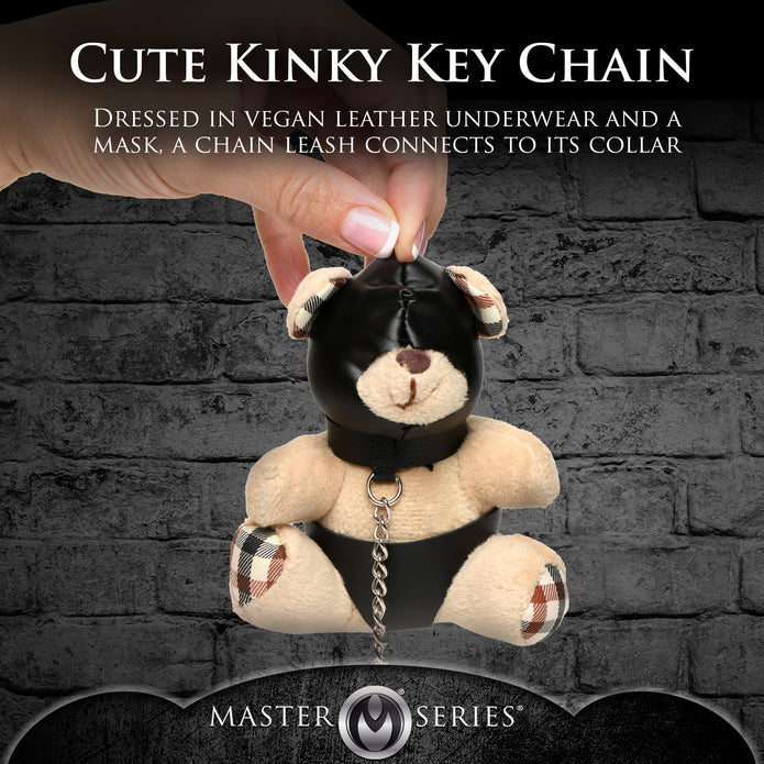 Light peach teddy bear keychain with hood, leather-look panties, and a chain leash, ideal as a gag gift or fun accessory.

hooded teddy bear keychain, BDSM bear keychain, gimp bear gift, bondage teddy bear keychain, kinky gag gifts, leather teddy keychain, teddy bear with chain leash, novelty bear keychain, gimp-themed teddy bear accessory, cheeky bondage gift.