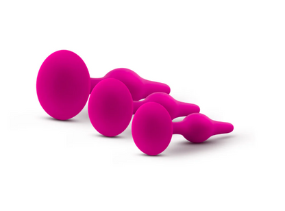 Luxe Beginner Plug Kit in Pink: Satin-smooth silicone, body-safe design, and three graduated sizes make this perfect for anal play beginners. Features tapered tips, suction cup bases, and easy-clean material.