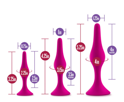 Luxe Beginner Plug Kit in Pink: Satin-smooth silicone, body-safe design, and three graduated sizes make this perfect for anal play beginners. Features tapered tips, suction cup bases, and easy-clean material.