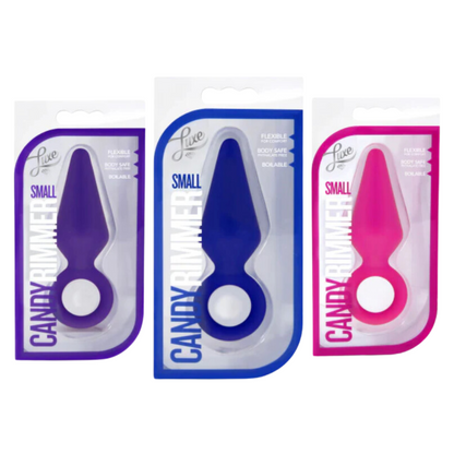 Packaging of the Candy Rimmer Small Butt Plug in purple, blue, and pink, featuring a flexible, body-safe silicone design that is boilable for sanitation.