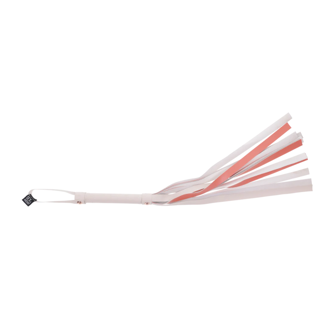 Peaches ‘n CreaMe Flogger: A playful flogger with 32-inch faux leather falls, a whimsical striped handle, and elegant rose gold accents. Perfect for flirty, teasing passion and satisfying strikes!