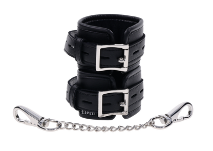 Edge® Handcuffs with padded black design, adjustable buckle closure, and removable metal tether for comfortable and secure BDSM play.