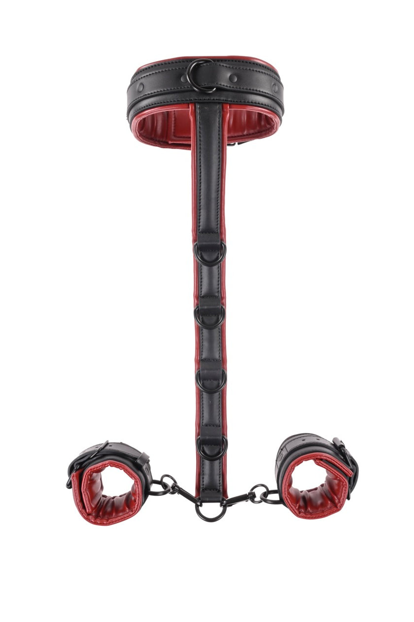 Saffron Neck and Wrist Restraint in red and black faux leather with adjustable straps and D-rings. Keywords: Saffron Neck and Wrist Restraint, BDSM neck and wrist restraint, faux leather bondage gear, adjustable BDSM restraints, Sportsheets neck restraint, red and black bondage, BDSM restraint system, D-ring bondage accessory, kink restraint kit, BDSM body harness.