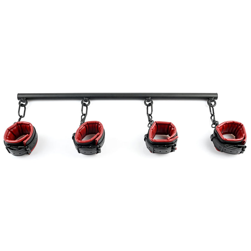 Saffron Spreader Bar and Cuff Set with red and black faux leather cuffs, matte black 24.75-inch spreader bar, and versatile swivel snap clips for bondage play.