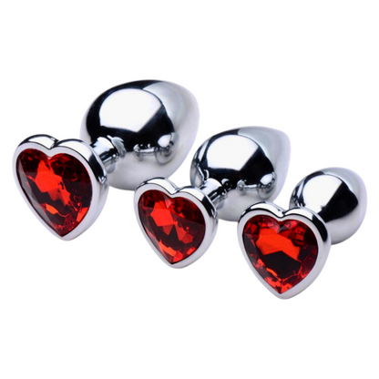 Set of Booty Sparks Heart Gem Anal Plugs in three sizes, featuring smooth metallic finishes with dazzling red heart-shaped gems. Crafted from nickel-free aluminum alloy for comfort and elegance.