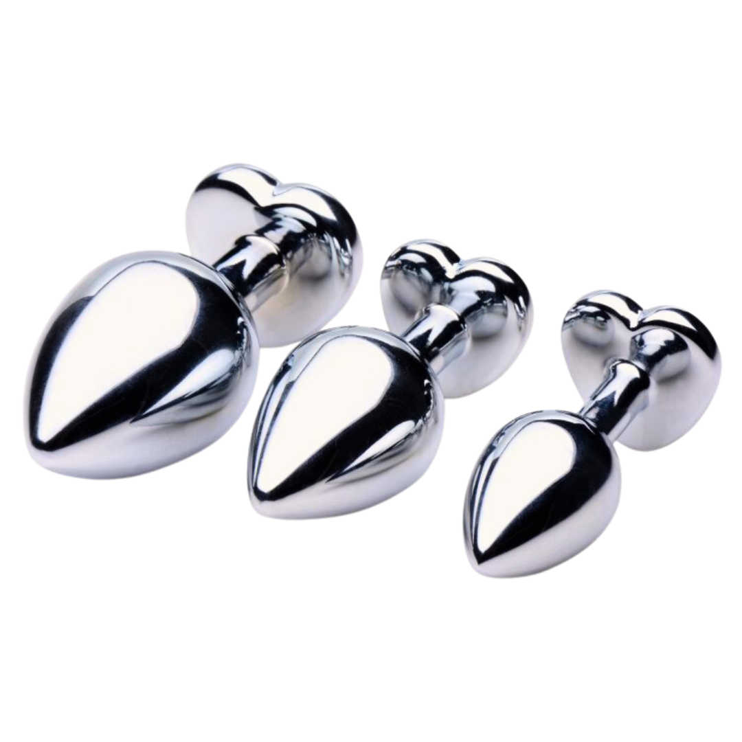 Set of Booty Sparks Heart Gem Anal Plugs in three sizes, featuring smooth metallic finishes with dazzling red heart-shaped gems. Crafted from nickel-free aluminum alloy for comfort and elegance.