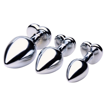 Set of Booty Sparks Heart Gem Anal Plugs in three sizes, featuring smooth metallic finishes with dazzling red heart-shaped gems. Crafted from nickel-free aluminum alloy for comfort and elegance.