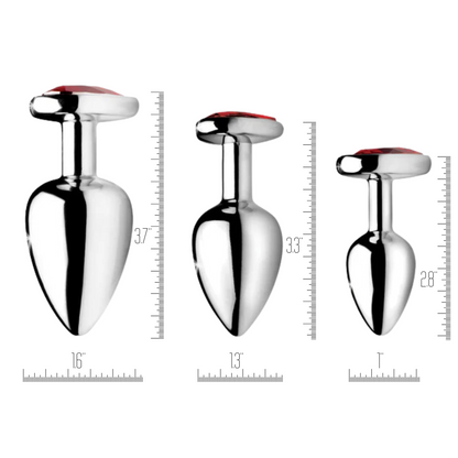 Set of Booty Sparks Heart Gem Anal Plugs in three sizes, featuring smooth metallic finishes with dazzling red heart-shaped gems. Crafted from nickel-free aluminum alloy for comfort and elegance.