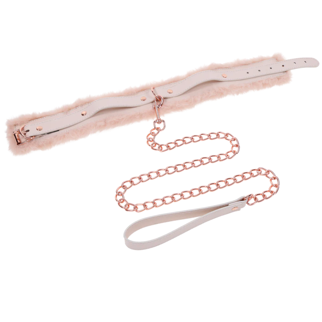 Luxurious peach-colored faux fur collar and leash set with rose gold hardware. Adjustable fit, detachable leash, and perfect for intimate power play or flirty fun.
