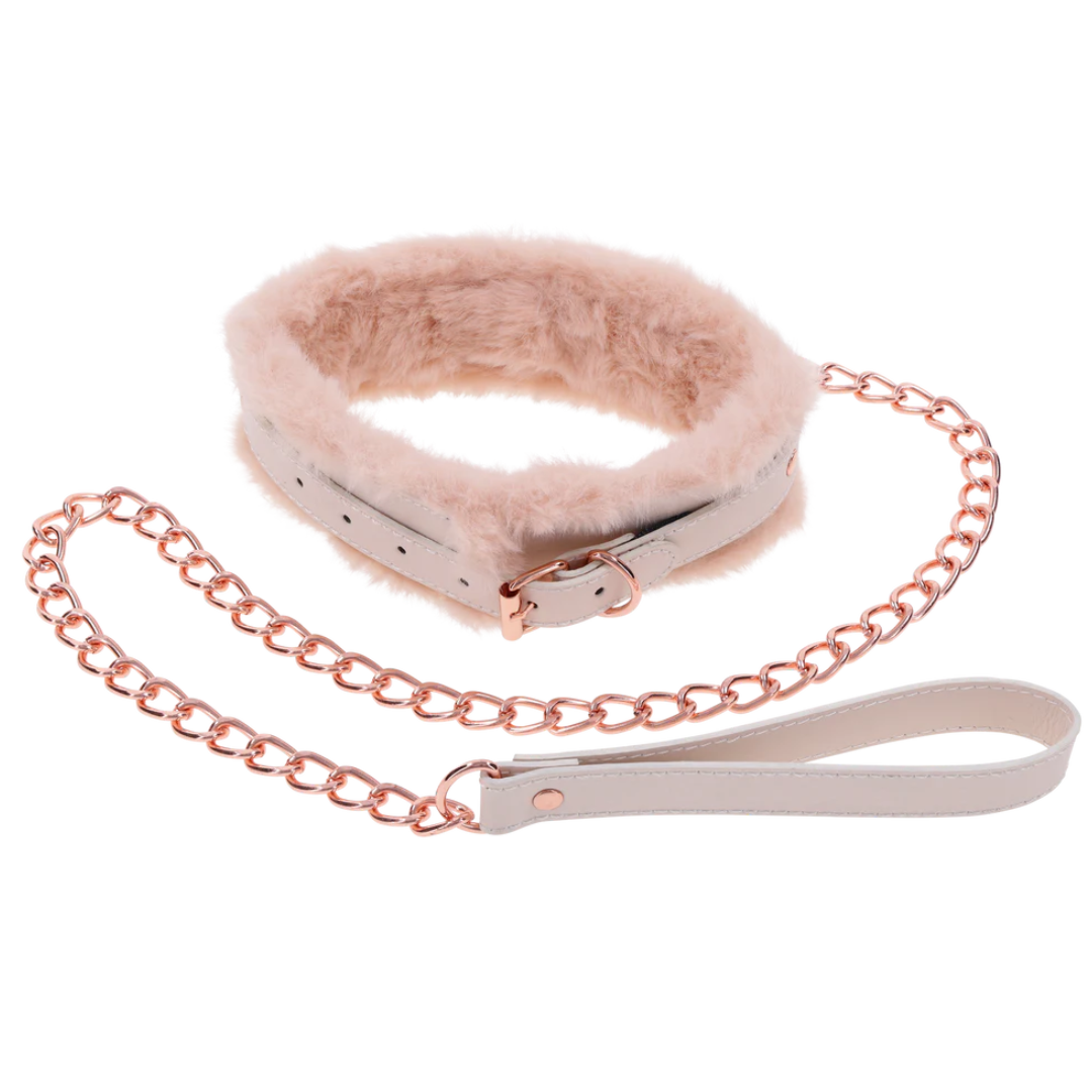 Luxurious peach-colored faux fur collar and leash set with rose gold hardware. Adjustable fit, detachable leash, and perfect for intimate power play or flirty fun.