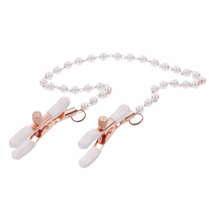Rose gold nipple clamps with faux pearl accents. Adjustable design with white rubber tips to enhance sensitivity. Hypoallergenic and nickel-free for safe, stylish play.
