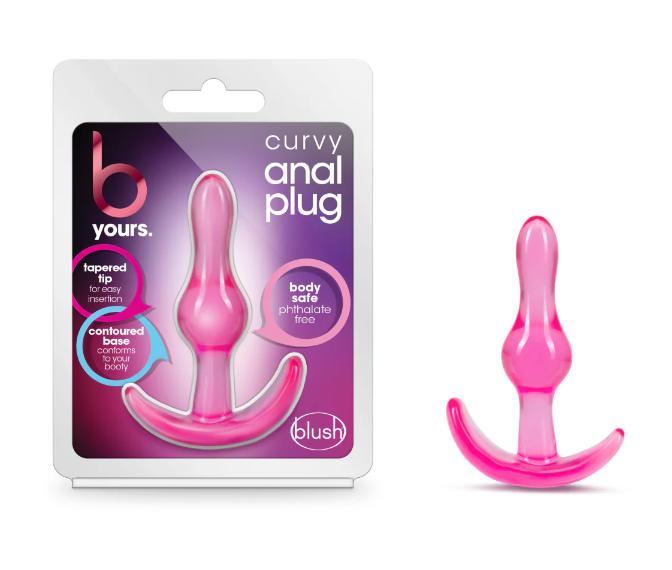 Packaging and product image of the B Yours Curvy Anal Plug by Blush, featuring a pink, tapered-tip anal plug with a contoured base. Packaging highlights include "body safe," "phthalate-free," "tapered tip for easy insertion," and "contoured base conforms to your body."