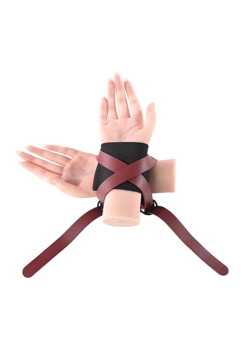 Ex's & Oh's Cross Cuffs with an X-shaped design, soft interior cuffs, adjustable 15-inch straps, and durable materials for stylish and secure restraint play.

