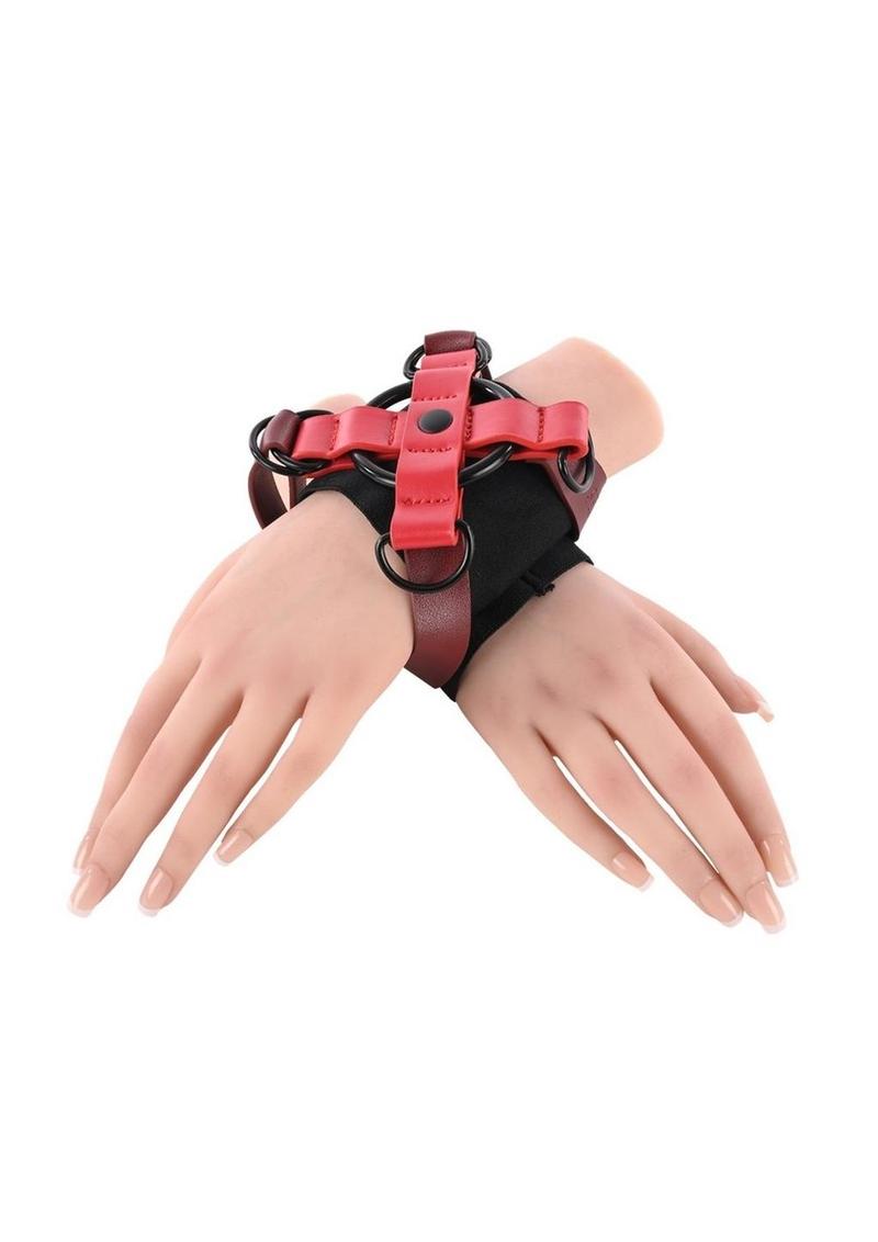 Ex's & Oh's Cross Cuffs with an X-shaped design, soft interior cuffs, adjustable 15-inch straps, and durable materials for stylish and secure restraint play.

