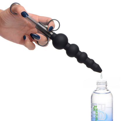 silicone lube launcher, graduated beads applicator, lubricant applicator, beaded lube injector, XL capacity lube launcher, water-based lube compatible, oil-based lube compatible, premium silicone applicator, phthalate-free applicator, non-porous lube injector, one-handed plunger lube launcher, beaded design applicator, precise lubricant application, easy-to-clean lube launcher, black silicone applicator, intimate care tool, lube launcher for pleasure, 7.5-inch lube applicator, hygienic lube injector, finger