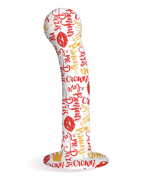 Product shown without packaging. Phallic shape with round tip and suction cup and flared base. Dildo is white with letters painted on it in red and yellow. Some images of lips and crowns are noted. Some of the words displayed are princess, crown, love, Paris, bonjour, me.